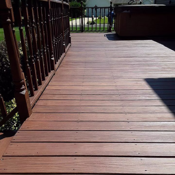 Pressure Washing Coloma MI - stained deck walkway with black railings