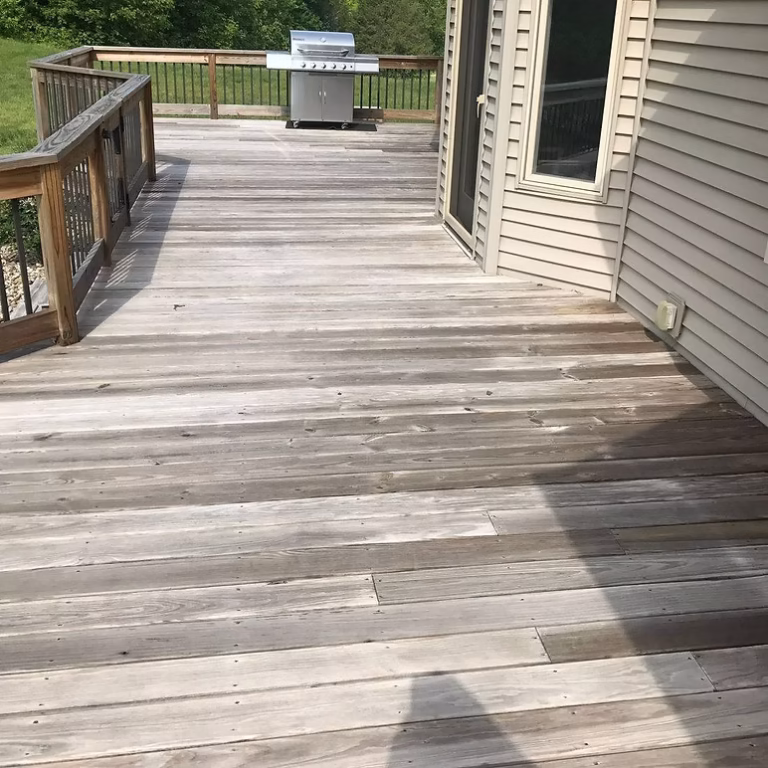 Pressure Washing Dowagiac MI - weathered gray deck before restoration